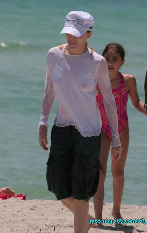 16P Madonna showing her hairy pussy and tits in wet seethru shirt