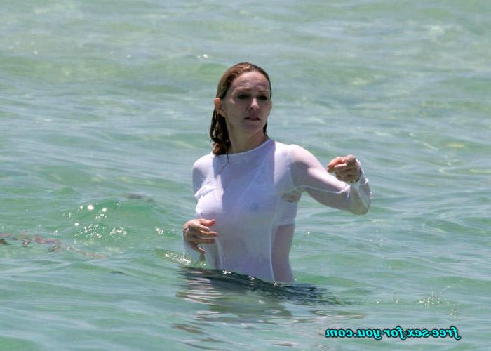 16P Madonna showing her hairy pussy and tits in wet seethru shirt