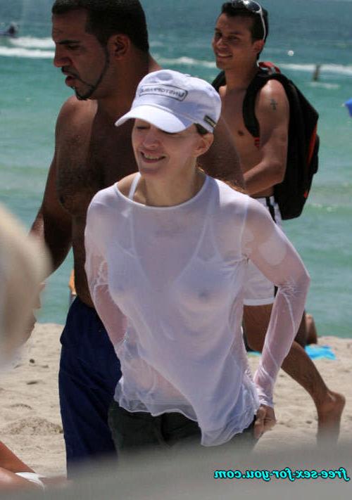 16P Madonna showing her hairy pussy and tits in wet seethru shirt