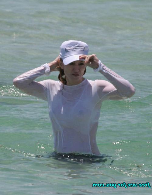 16P Madonna showing her hairy pussy and tits in wet seethru shirt