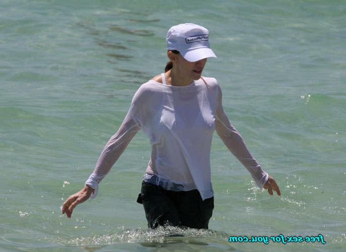 16P Madonna showing her hairy pussy and tits in wet seethru shirt