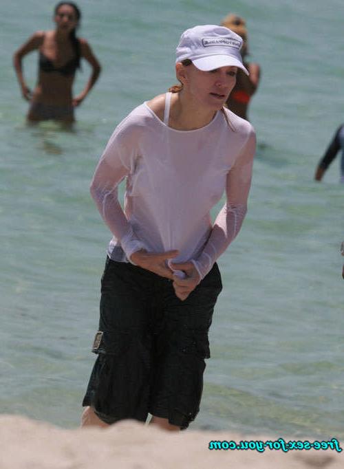 16P Madonna showing her hairy pussy and tits in wet seethru shirt