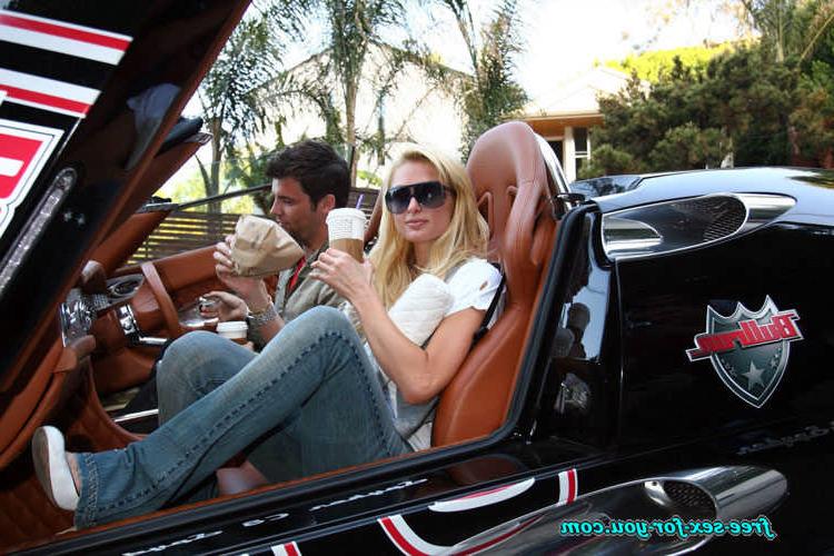 16P Paris Hilton posing in see thru and in fishnet pantyhose