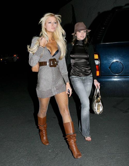 16P Paris Hilton posing sexy in fishnet stockings and mini skirt