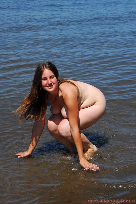 16P Cute plump fullbush nudist bares big tits at beach