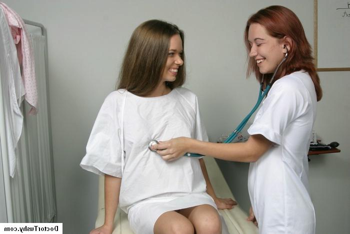 16P Redhead nurse doing a medical exam