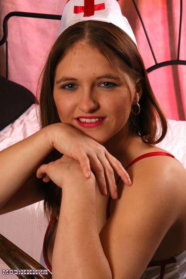 16P Busty Redhead Nurse Stripping and Showing off Her Pussy