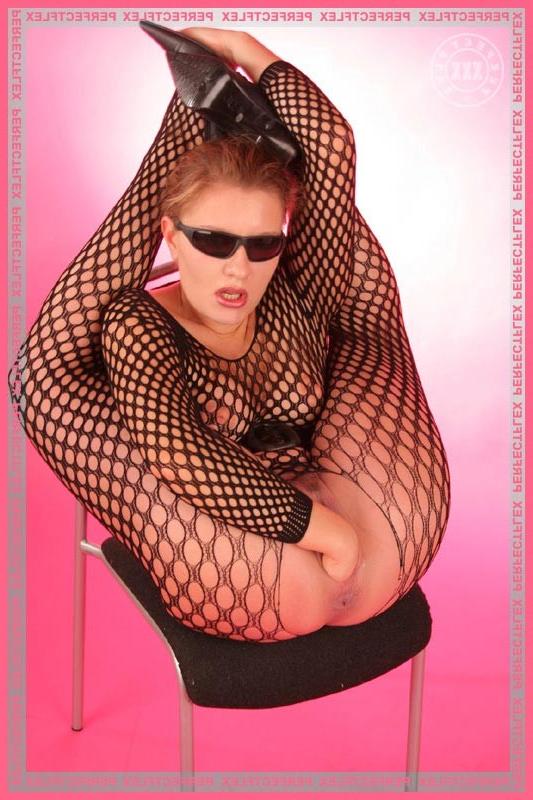 17P Tempting flexible lady in a sexy fishnet suit fisting herself