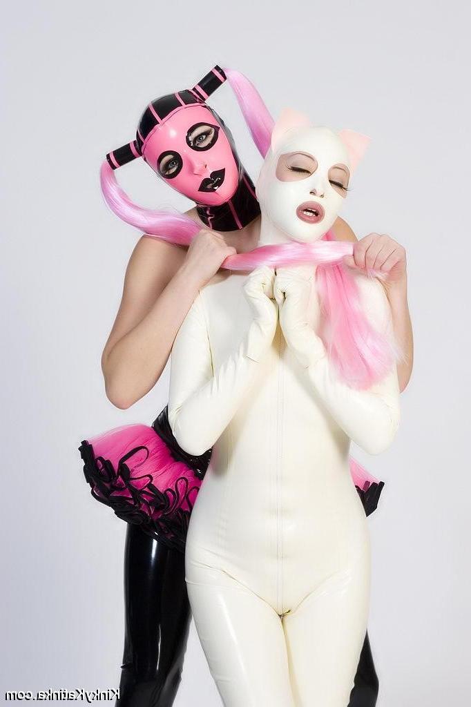 16P Two babes wearing kinky latex outfits