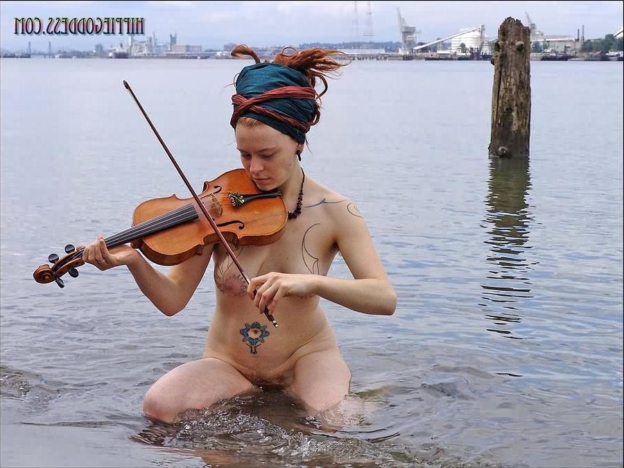 15P Hairy redhead nudist plays a violin naked at beach