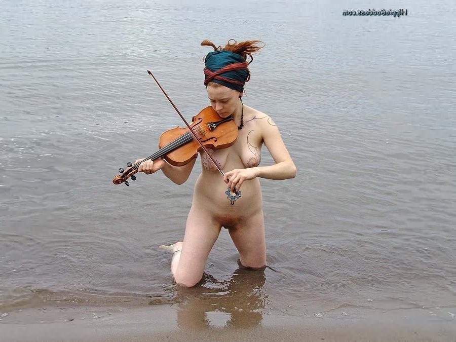 15P Hairy redhead nudist plays a violin naked at beach