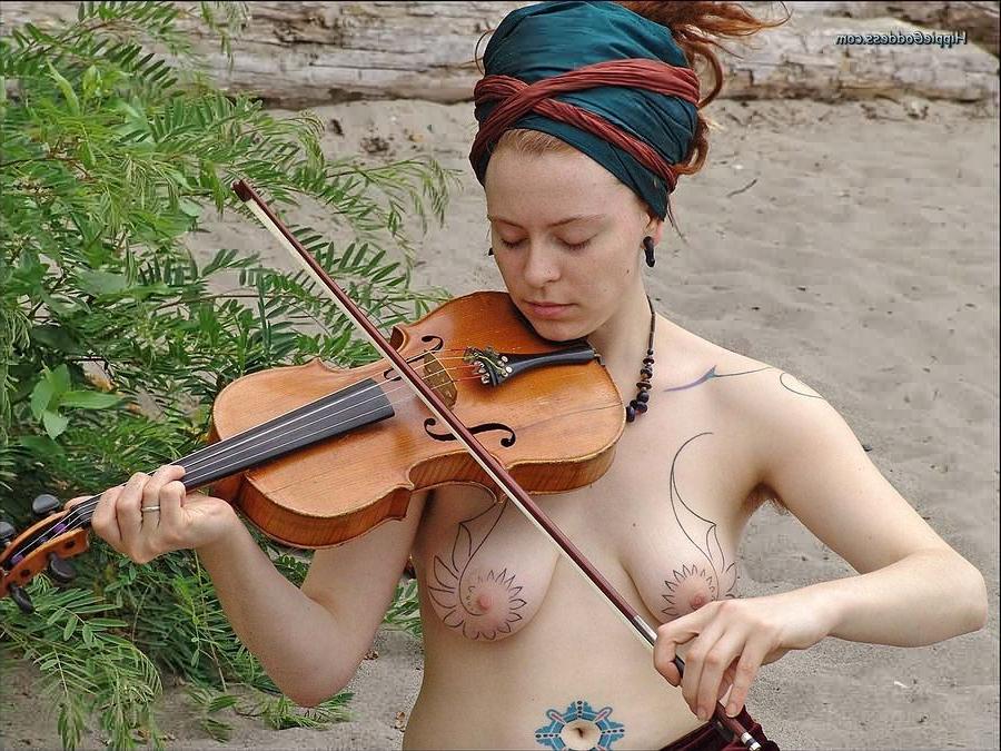 15P Hairy redhead nudist plays a violin naked at beach