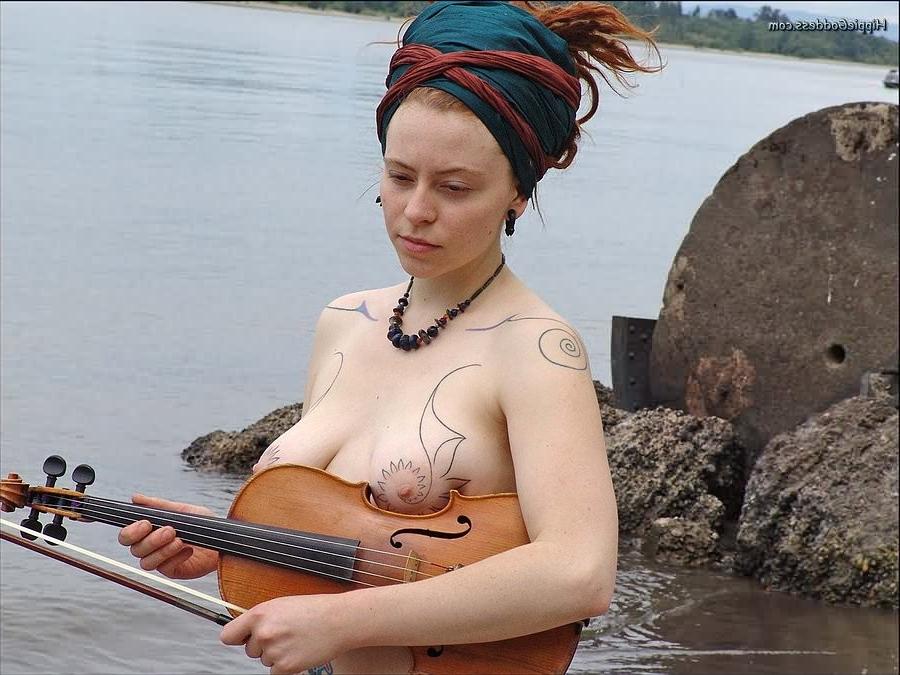 15P Hairy redhead nudist plays a violin naked at beach