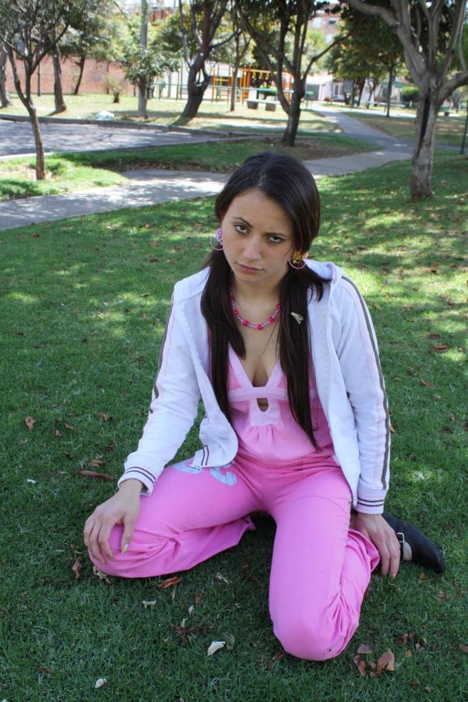 16P Latina teen girl at public playground