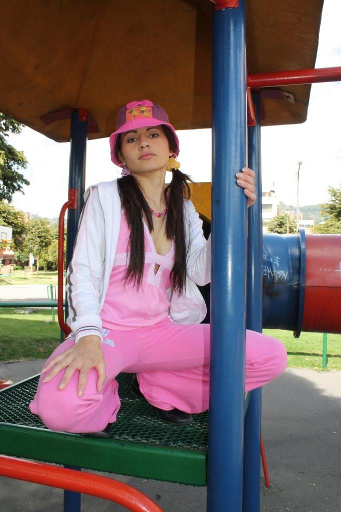 16P Latina teen girl at public playground