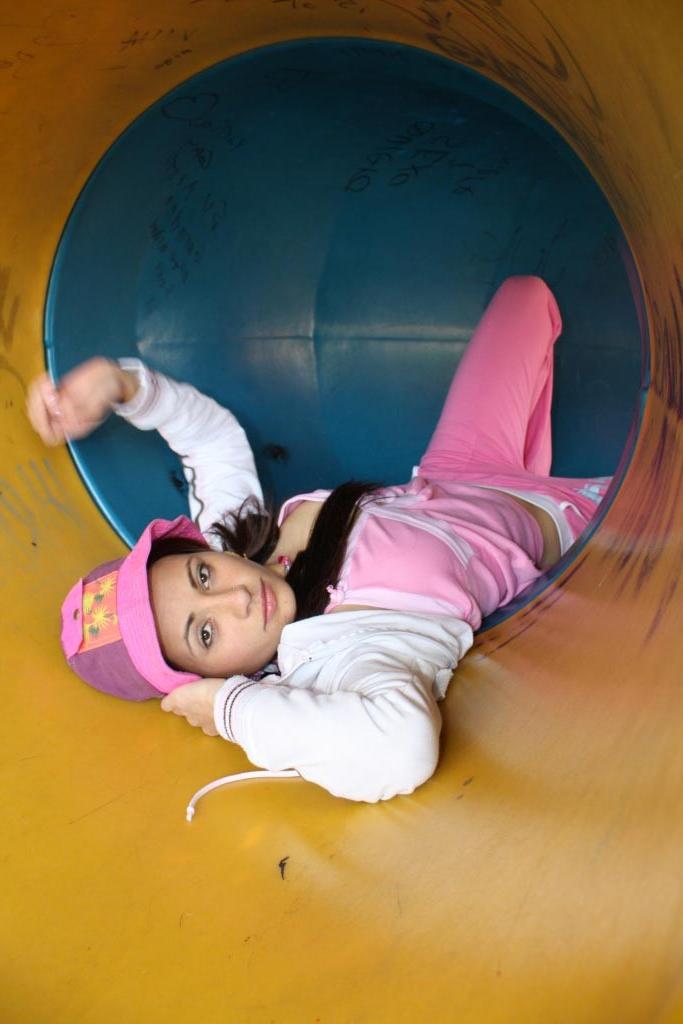 16P Latina teen girl at public playground