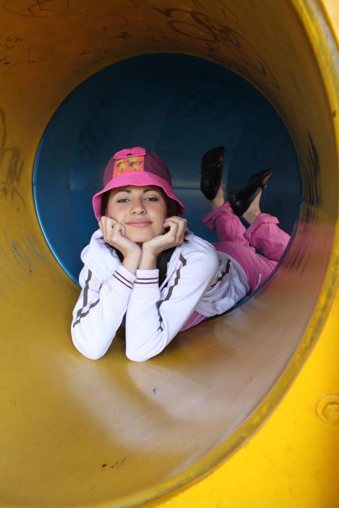 16P Latina teen girl at public playground
