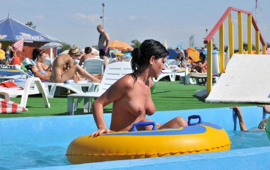15P Sexy Latina bares her tits in the pool