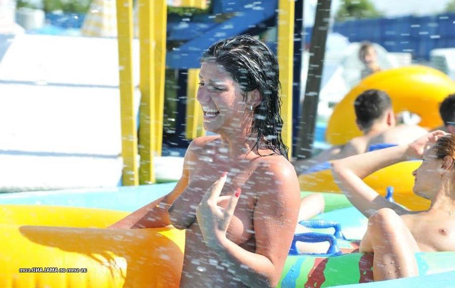 15P Sexy Latina bares her tits in the pool