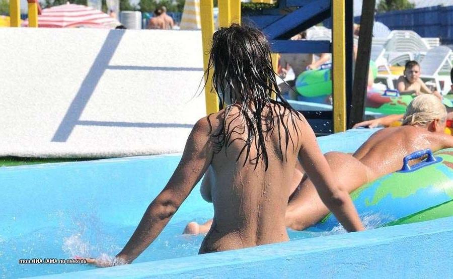15P Sexy Latina bares her tits in the pool