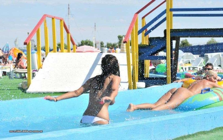15P Sexy Latina bares her tits in the pool