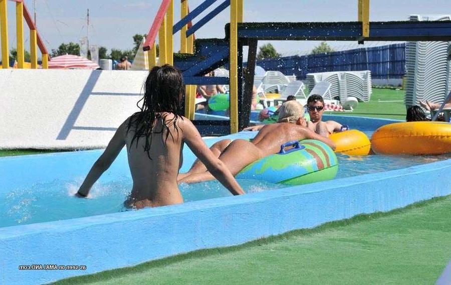 15P Sexy Latina bares her tits in the pool