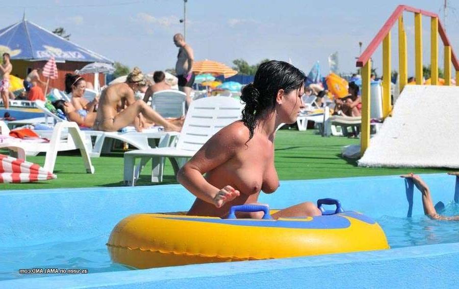 15P Sexy Latina bares her tits in the pool