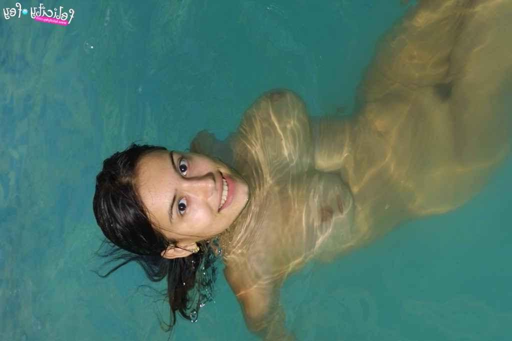 25P Busty latina in fishnet skirt having fun at the pool