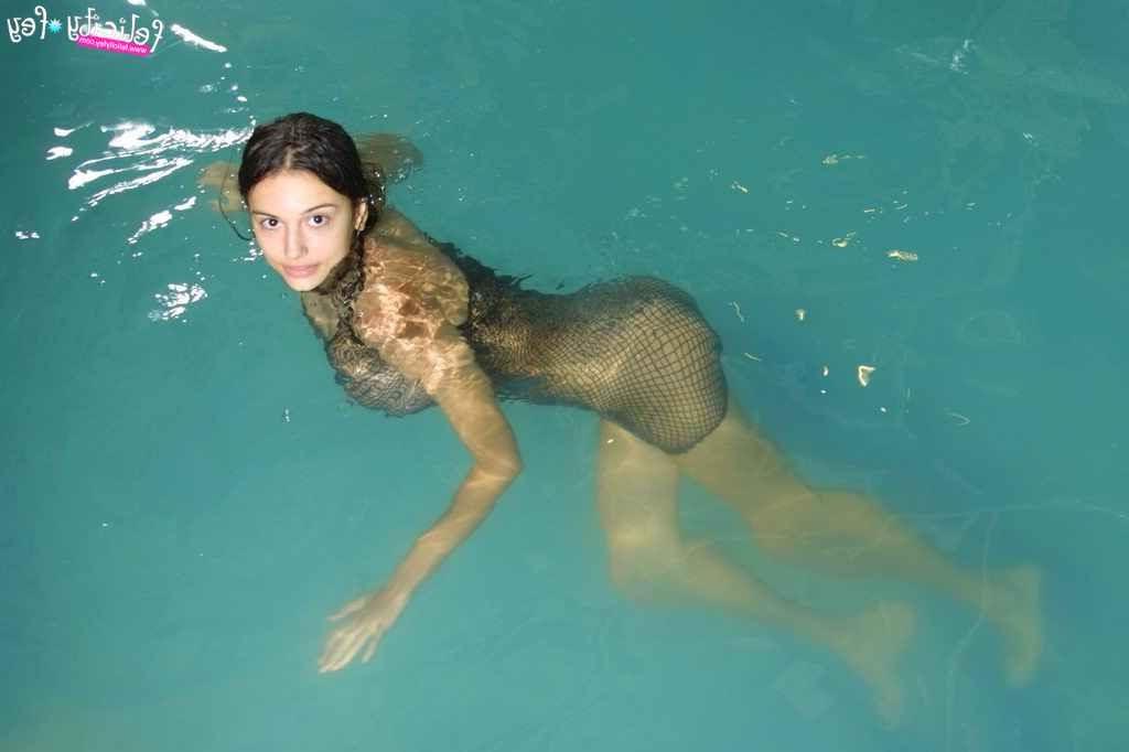25P Busty latina in fishnet skirt having fun at the pool