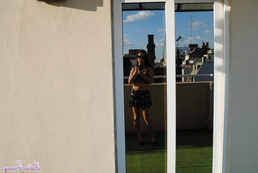 12P Sexy Nicole posing on the rooftop