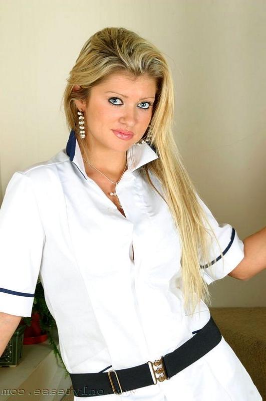 16P Sexy busty nurse in black stockings stripping down