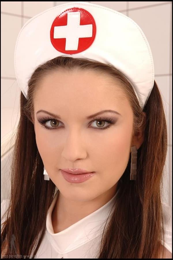 16P Busty brunette in latex nurse uniform