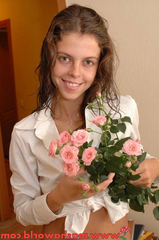 15P Cute russian teen girl posing with pink roses