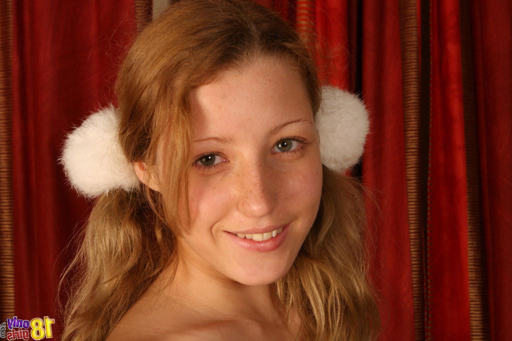 15P Lovely blond teen pulling down her jeans