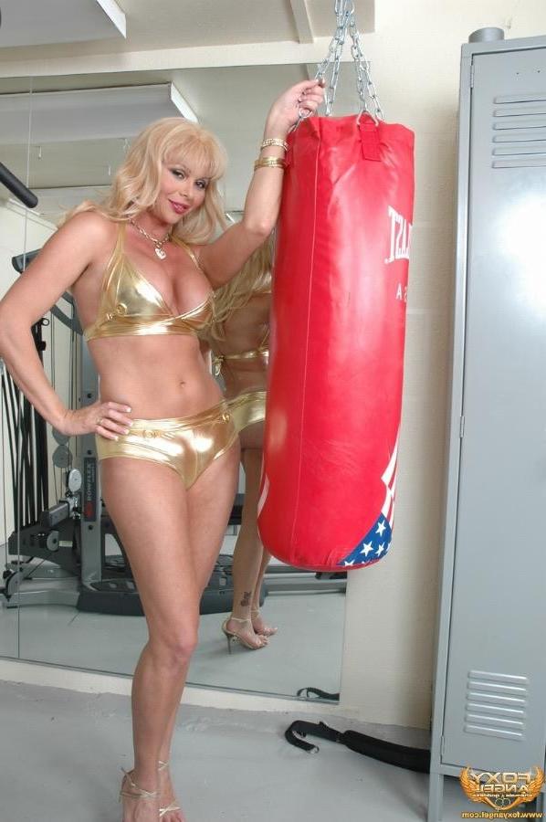 16P Blonde tranny Foxy Angel showing her big cock in the gym