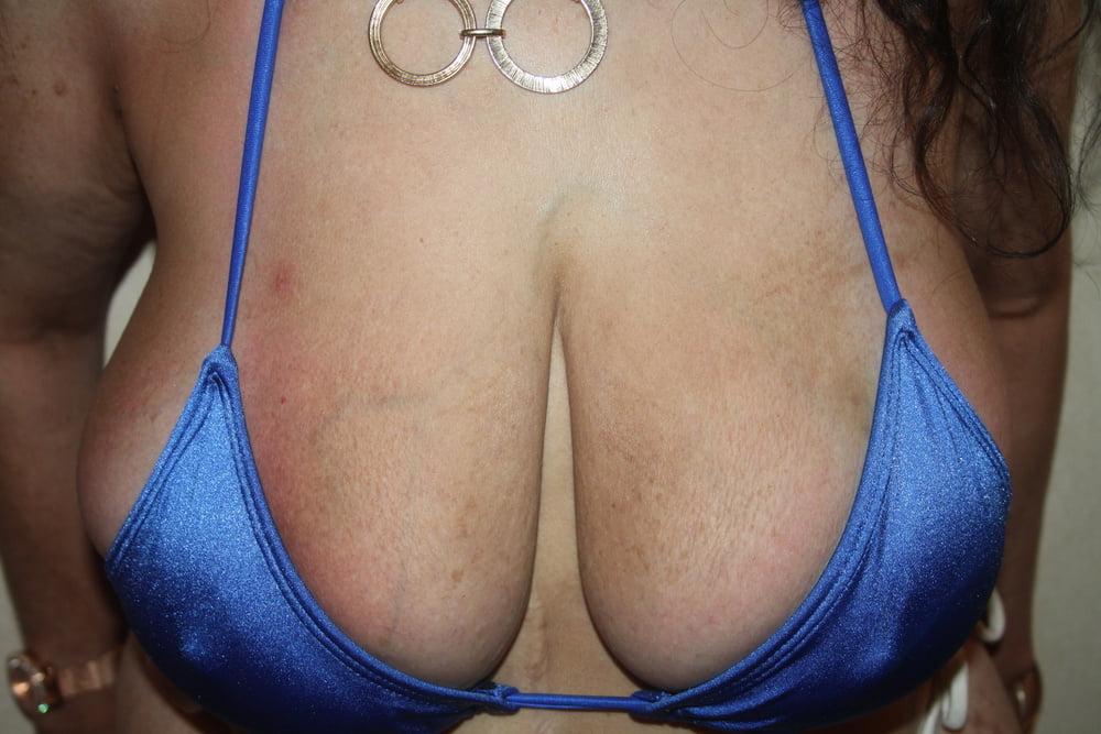 25P Tinja Stretches Her Blue And White String Bikini