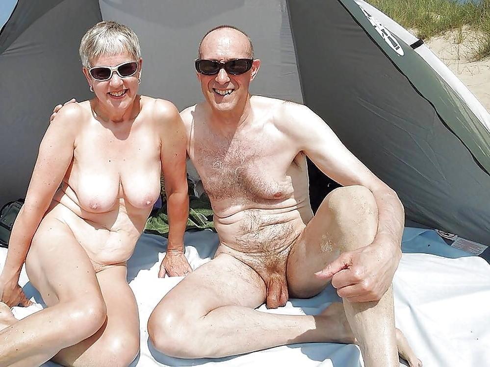 25P 0704 Nude beach couples and groups.