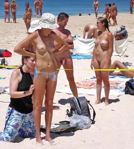 25P 0704 Nude beach couples and groups.
