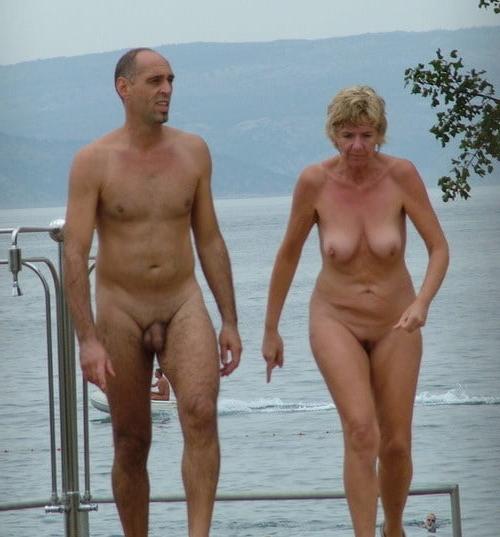 25P 0704 Nude beach couples and groups.