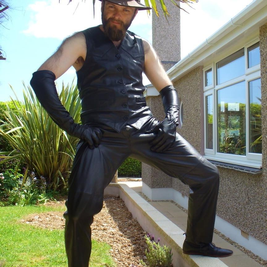 15P Leather Master outdoors posing in full leather