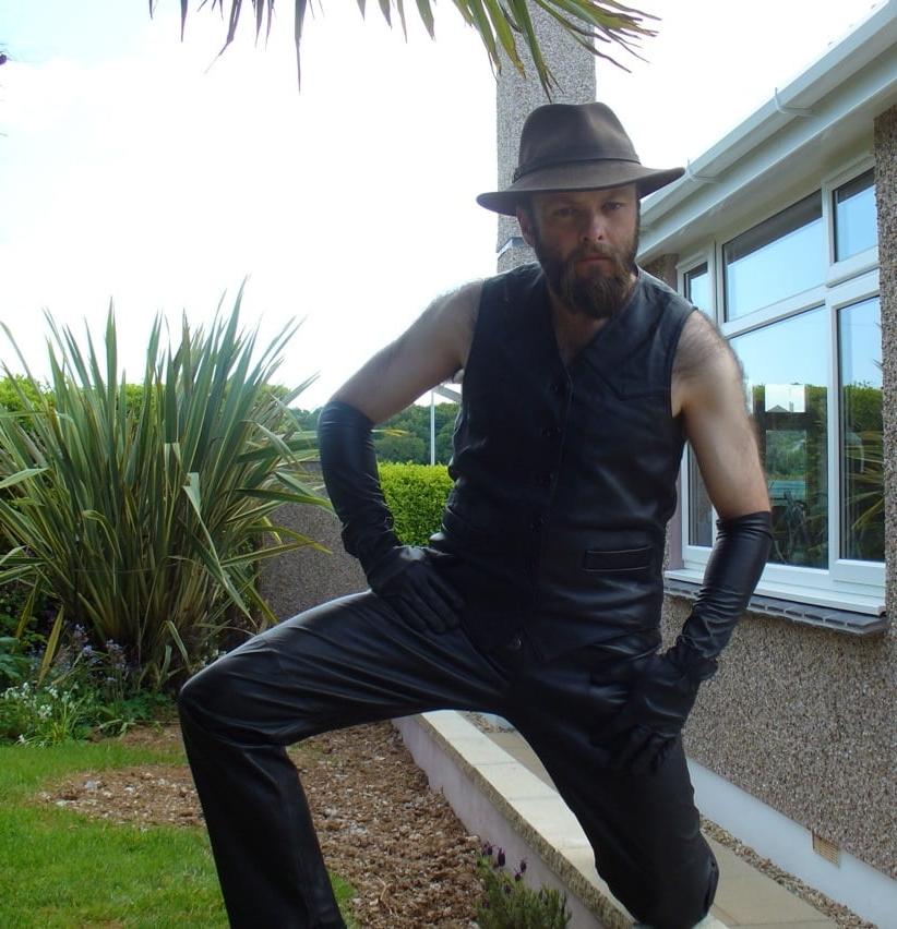 15P Leather Master outdoors posing in full leather