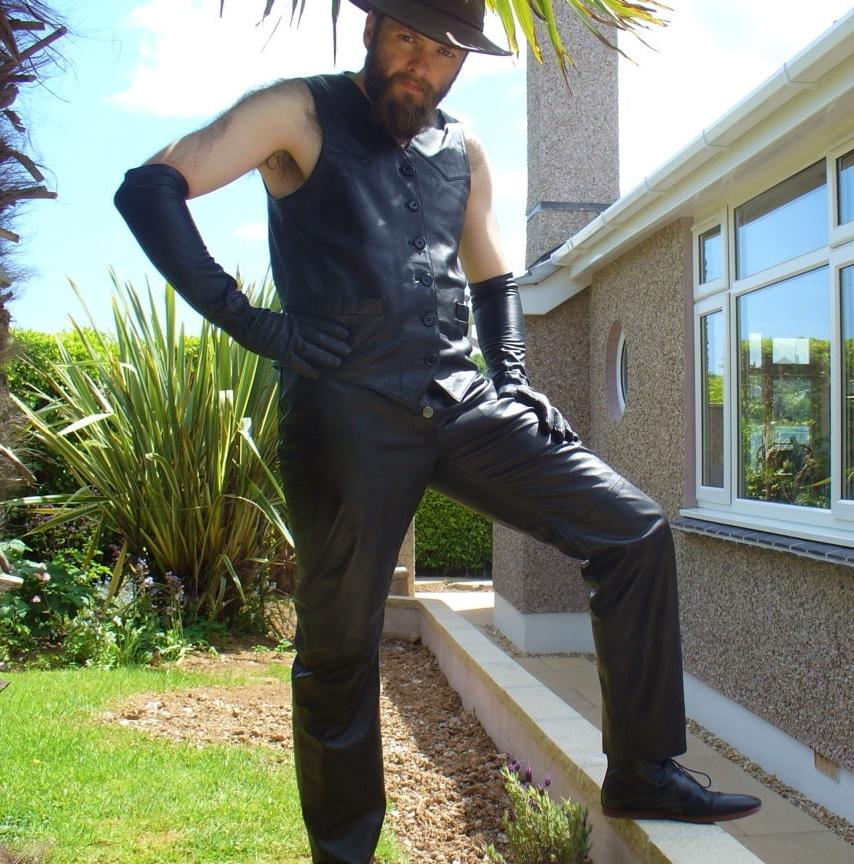 15P Leather Master outdoors posing in full leather