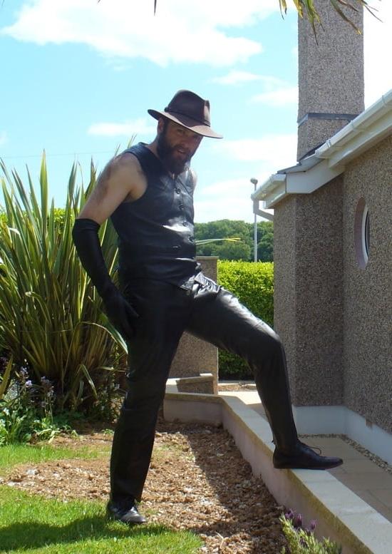 15P Leather Master outdoors posing in full leather