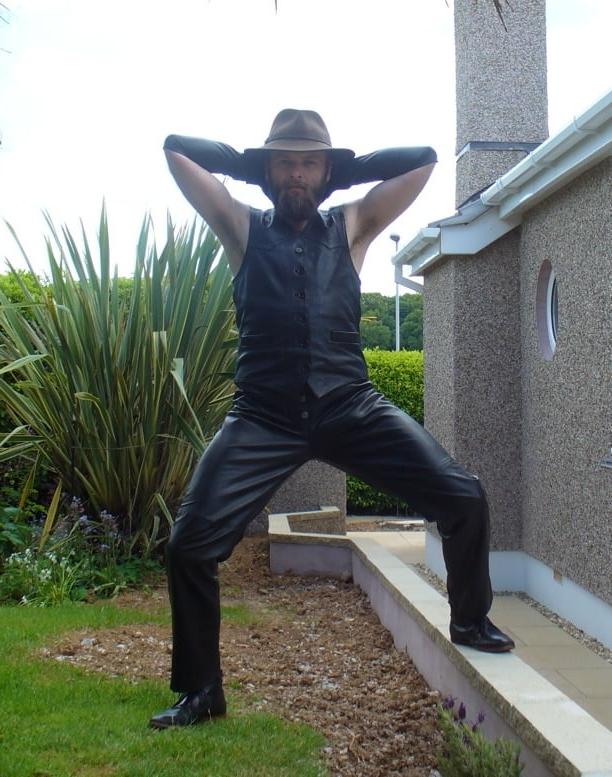 15P Leather Master outdoors posing in full leather