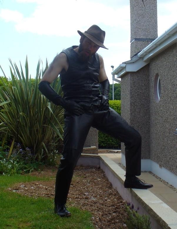 15P Leather Master outdoors posing in full leather