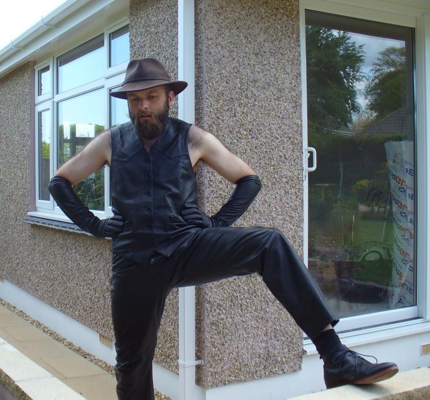 15P Leather Master outdoors posing in full leather