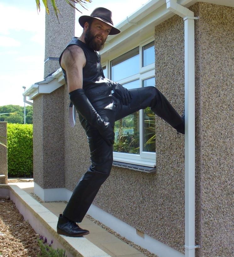 15P Leather Master outdoors posing in full leather