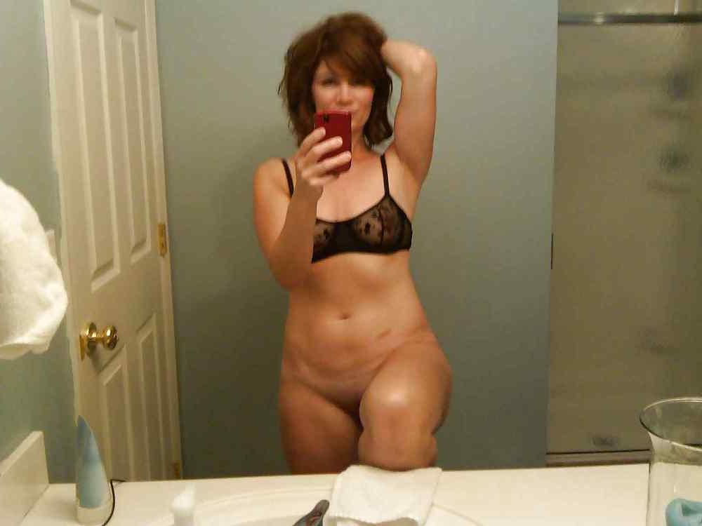 22P Beautiful mature woman taking a photo