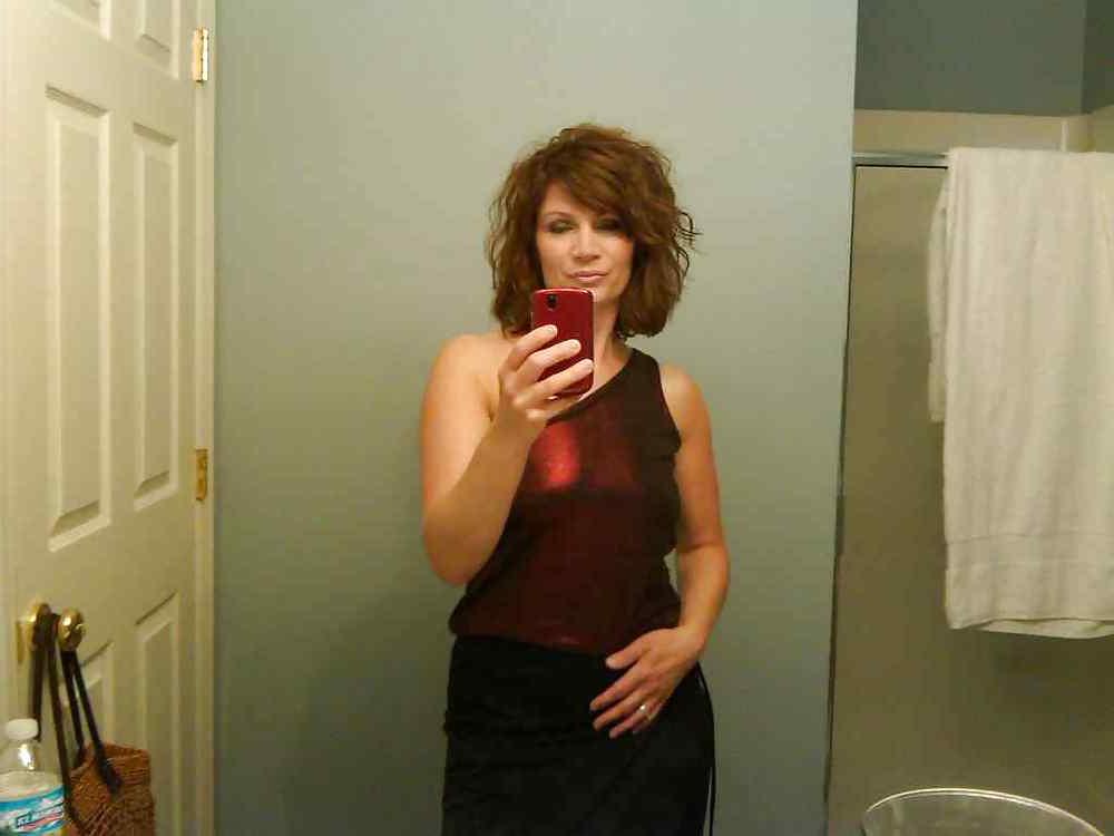 22P Beautiful mature woman taking a photo