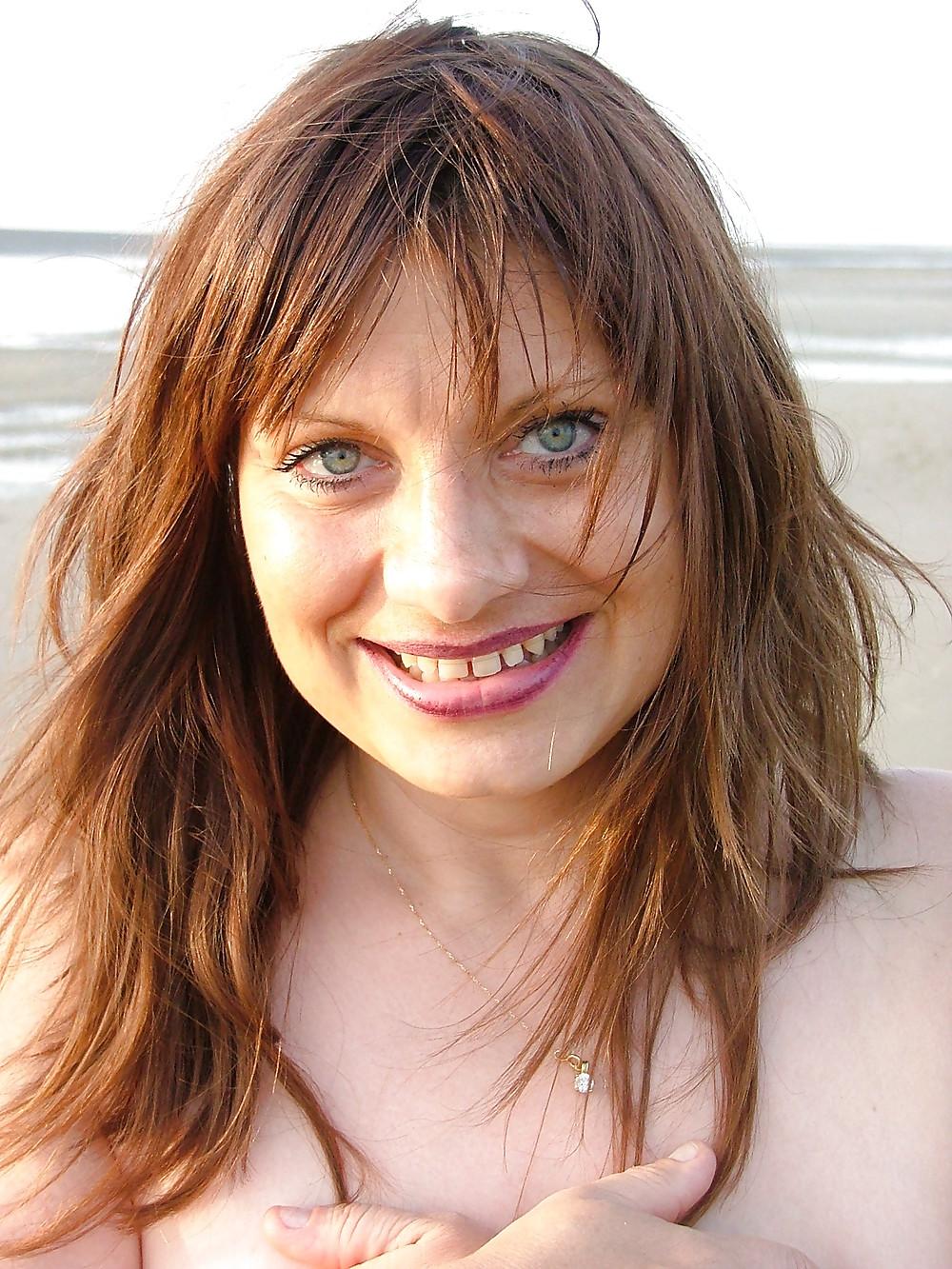 24P Busty women at the beach.